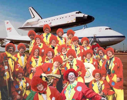 Clowns in front of... uhh... the space shuttle...