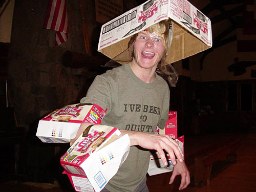 Dane wearing his "I've Been to Duluth" t-shirt, dressed up in IBC rootbeer cases, pretending he's a raptor